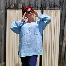 Load image into Gallery viewer, Ada-long-sleeve-Vneck-muslin-blouse-features-front-pockets-and-sleeve-tabs-in-ice-blue-worn-with-navy-casual-pants