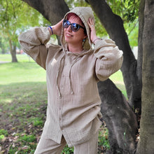 Load image into Gallery viewer, Ada-women's-muslin-hooded-button-front-shirt-in-latte-worn-with-women's-tie-waist-pants-latte