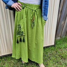 Load image into Gallery viewer, Ness-voile-midi-skirt-with-embroidered-front-pockets-and-elasticated-string-tie-waist-lime-colour-close-up-detail