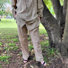 Load image into Gallery viewer, muslin-women's-tie-waist-pants-featuring-elasticated-string-tie-waist-and-side-pockets-in-latte-worn-with-Ada-muslin-hooded-shirt-in-latte