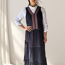 Load image into Gallery viewer, button-front-band-collar-tunic-shirt-with-button-tab-long-sleeves-mid-length-curved-hem-in-white-layered-with-coral-sleeveless-maxi-dress-in-black-front-view