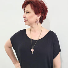Load image into Gallery viewer, vintage-style-dusty-pink-lotus-flower-bronze-necklace-with-swarovski-pearl-drop-detail-on-model-with-matching-earrings