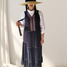 Load image into Gallery viewer, coral-sleeveless-maxi-dress-with-embroidery-detail-on-Vneckline-and-front-bodice-and-wide-tiered-skirt-with-lace-trim-in-black-worn-with-white-shirt-front-view