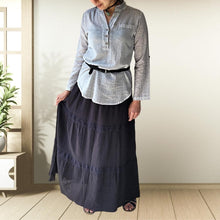 Load image into Gallery viewer, dahlia-tiered-maxi-skirt-with-lace-trim-in-black-worn-with-V-neck-blouse-in-stone-and-black-thin-belt-and-leather-sandals-front-view