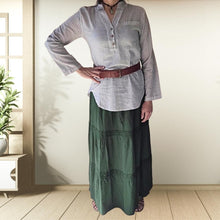 Load image into Gallery viewer, dahlia-tiered-maxi-skirt-with-lace-trim-in-green-worn-with-V-neck-blouse-in-stone-and-brown-wide-belt-and-leather-sandals-front-view