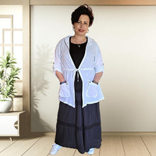 Load image into Gallery viewer, delta-hooded-tunic-with-button-tab-long-sleeves-drawstring-waist-and-front-pockets-in-white-front-view