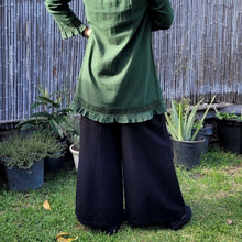 Load image into Gallery viewer, Luna high-waisted, wide leg, brushed cotton, women's pants in black with green tunic viewed from the back