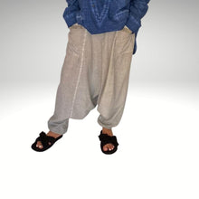 Load image into Gallery viewer, crochet-crossover-strap-slip-on-women's-slippers-black-on-feet-with-maira-shalwar-pants