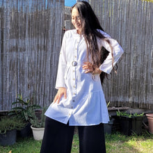 Load image into Gallery viewer, sile-cotton-button-through-tunic-dress-in-white-with-shirt-collar-fabric-belt-ruffle-hem-and-long-sleeves-with-button-tabs