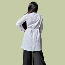 Load image into Gallery viewer, long-sleeve-brushed-cotton-tunic-dress-in-white-with-embroidery-detail-on-sleeve-cuffs-showing-string-tie-waist-back