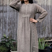 Load image into Gallery viewer, long-sleeve-cotton-maxi-dress-in-mocha-with-eyelet-embroidery-on-front-sides-pintuck-detail-on-chest-close-up-of-front-detail