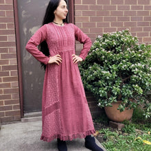 Load image into Gallery viewer, long-sleeve-cotton-maxi-dress-in-rose-with-eyelet-embroidery-on-front-sides-pintuck-detail-on-chest-lace-frill-at-skirt-hem-and-string-tie-at-waist-back