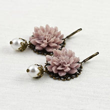 Load image into Gallery viewer, vintage-style-dusty-pink-lotus-flower-bronze-earrings-with-swarovski-pearl-drops-lying-on-flat-surface